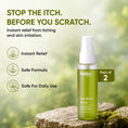 Load image into Gallery viewer, A bottle of Dadaz Plant Itch Relief Spray stands on a mossy rock against a blurred green natural background. Large text at the top reads 'STOP THE ITCH'.

